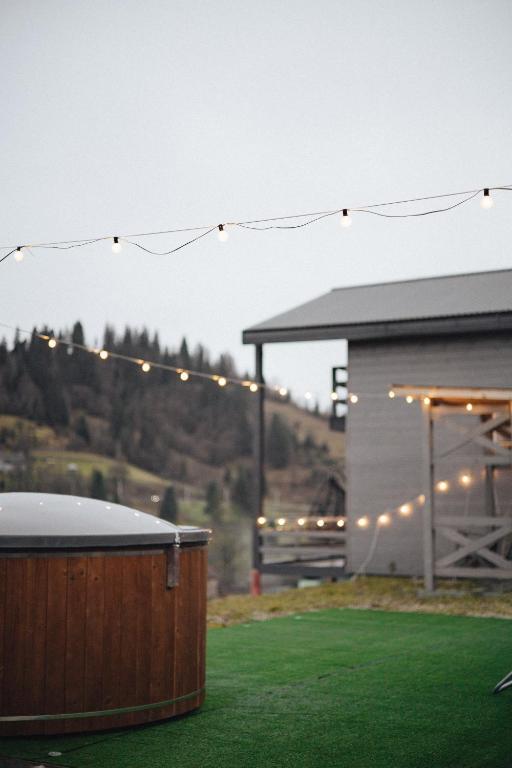 a string of lights over a yard with a building at Forest Cliff Славське in Slavske