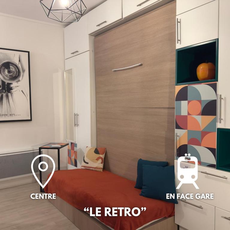 a bedroom with a sliding door with a bed and anace gate at Le Retro Gaming - Le Havre Train Station in Le Havre