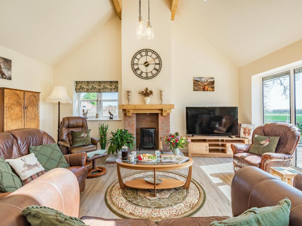 Posezení v ubytování Lizzie's Cottage