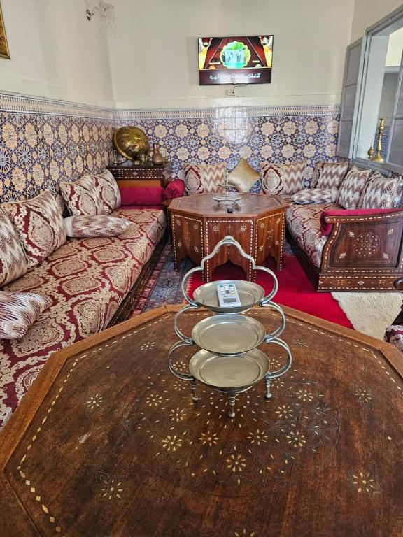 a living room with a couch and a table at Marrakech plus in Marrakesh
