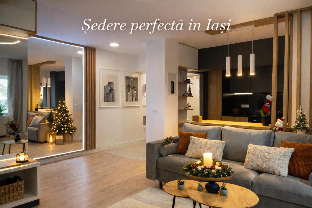 a living room with a couch and a table at Palas Loft in Iaşi