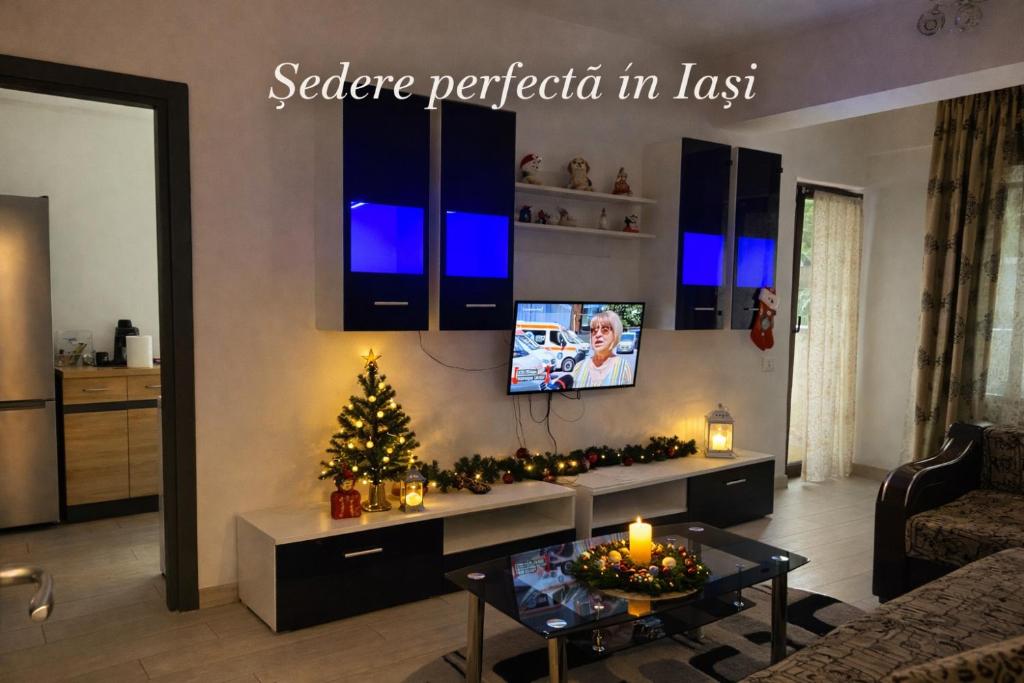 a living room with a christmas tree and a tv at Bridge tower Residence in Iaşi