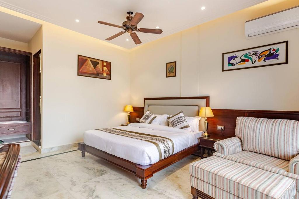 a bedroom with a bed and a couch at The Himalayan Residency in Duttnager