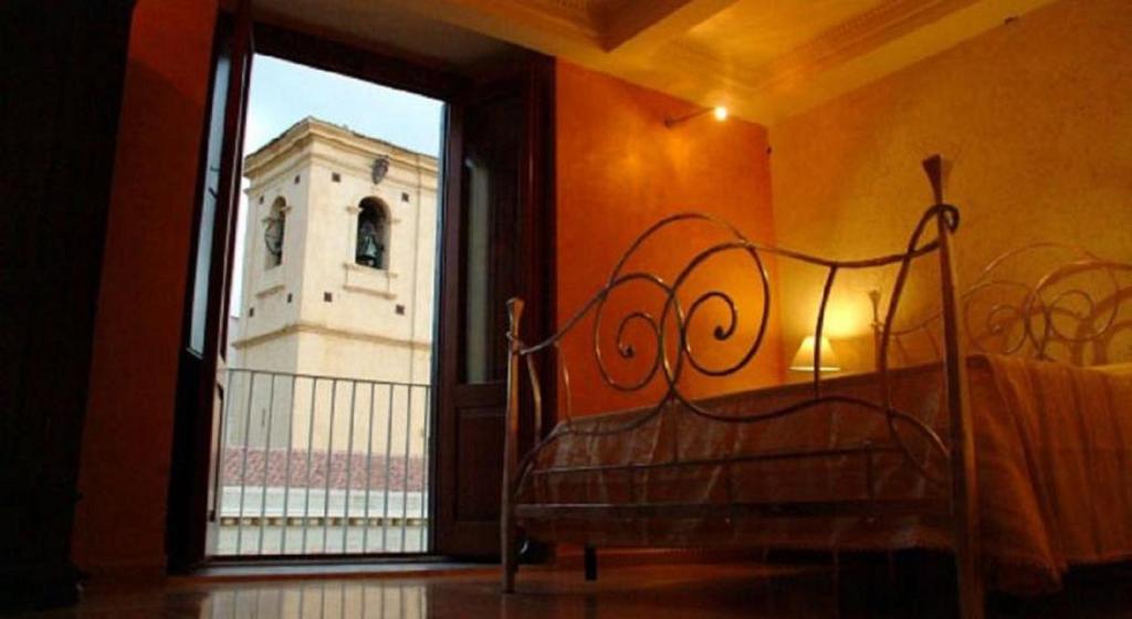 Postel nebo postele na pokoji v ubytování Residenza Il Duomo