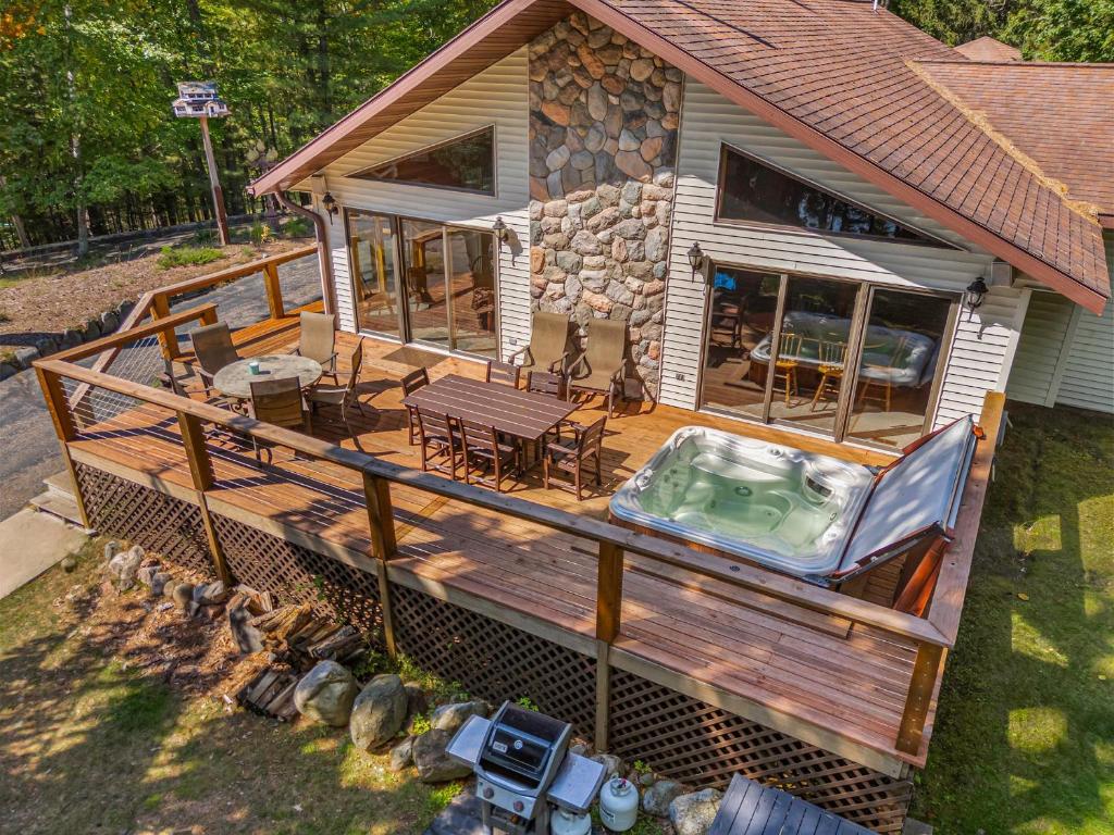 an overhead view of a house with a hot tub on a deck at Tall Pines Lodge in Eagle River WI in Eagle River