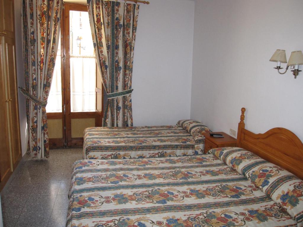 Cama o camas de una habitación en Fonda Agustí