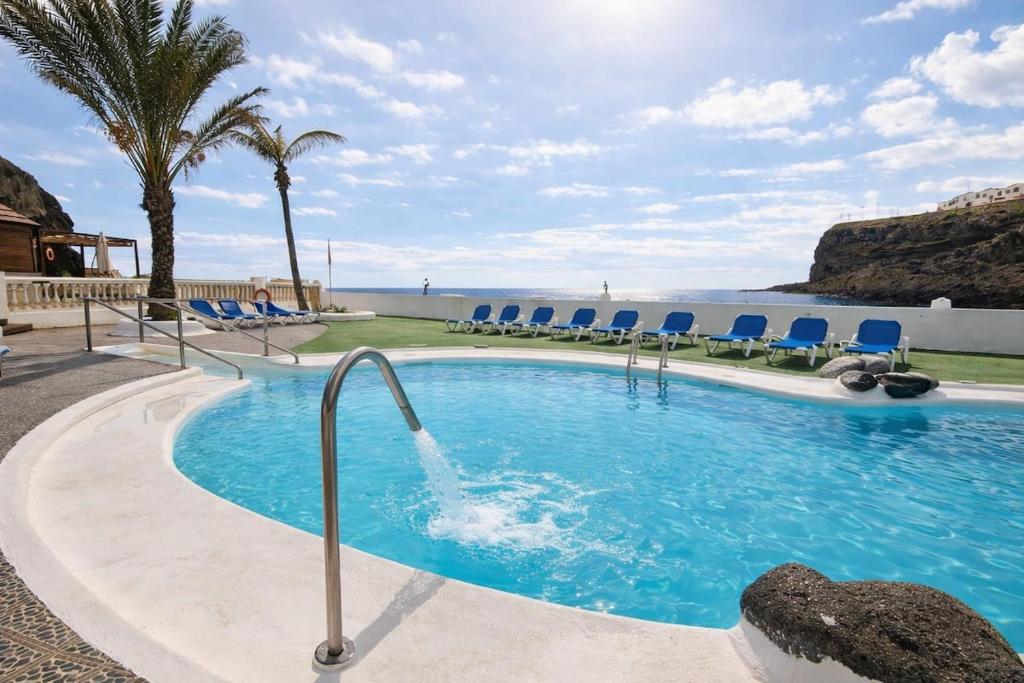 Swimmingpoolen hos eller tæt på Apartamento Costero con Piscina en Telde