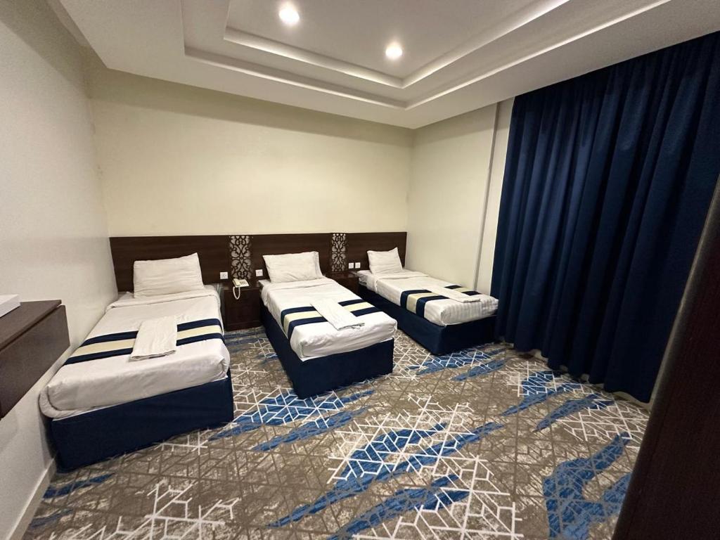 Postel nebo postele na pokoji v ubytování فندق الماسة ذاخر