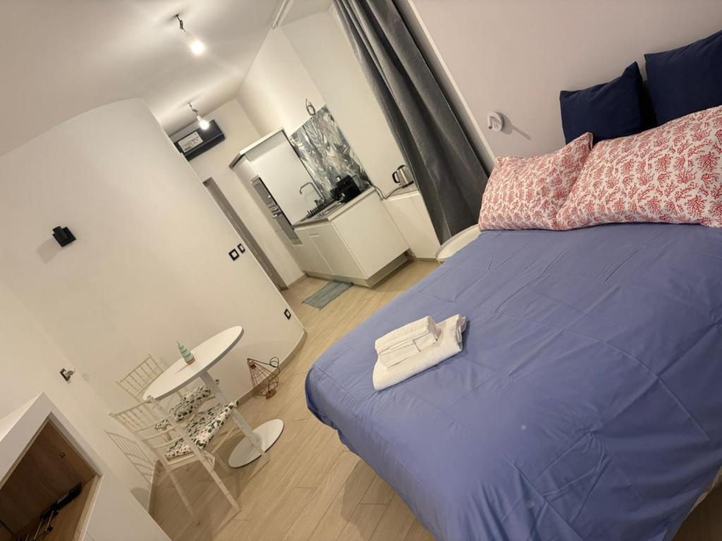 En eller flere senge i et værelse på Casa Acquarello