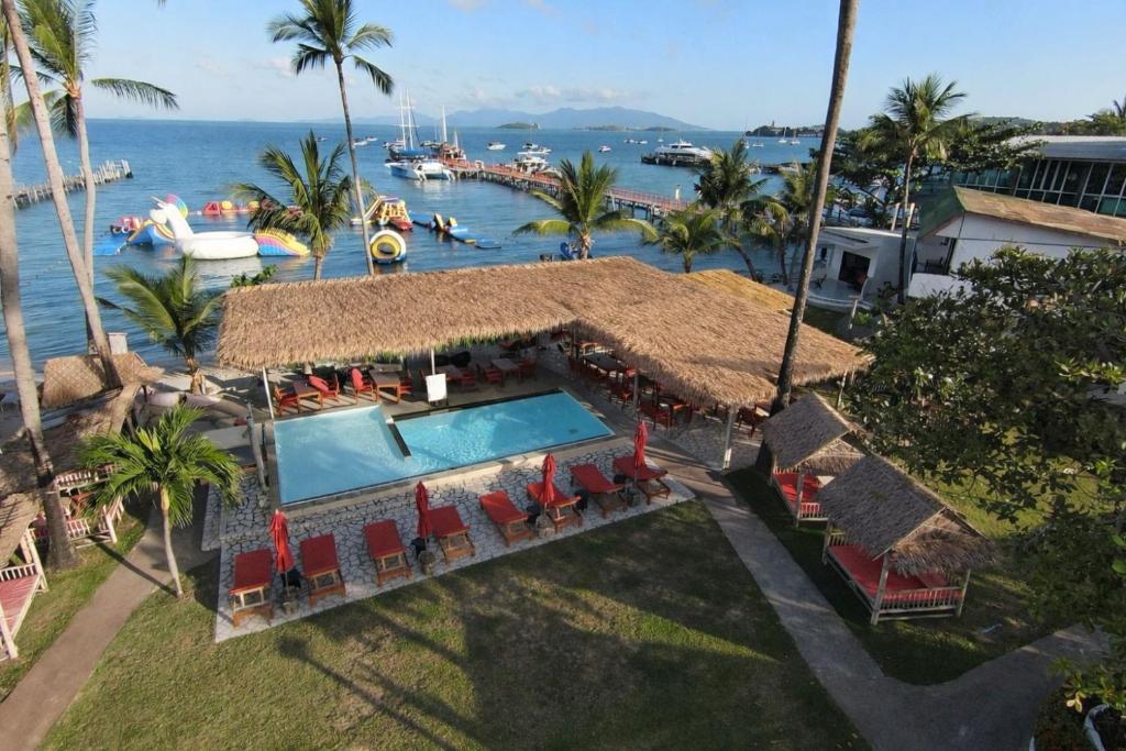 an aerial view of a house with a swimming pool at Samui Pier Beach Front & Resort in Bangrak Beach