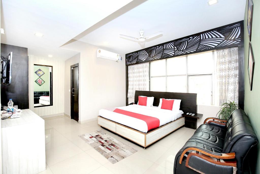 En eller flere senge i et værelse på Hotel O Karma