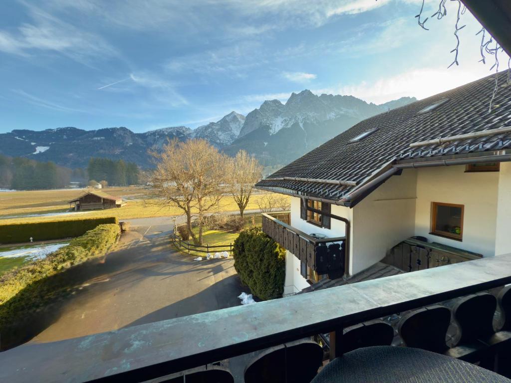 a view from the balcony of a house with mountains in the background at Gästehaus Florian in Grainau
