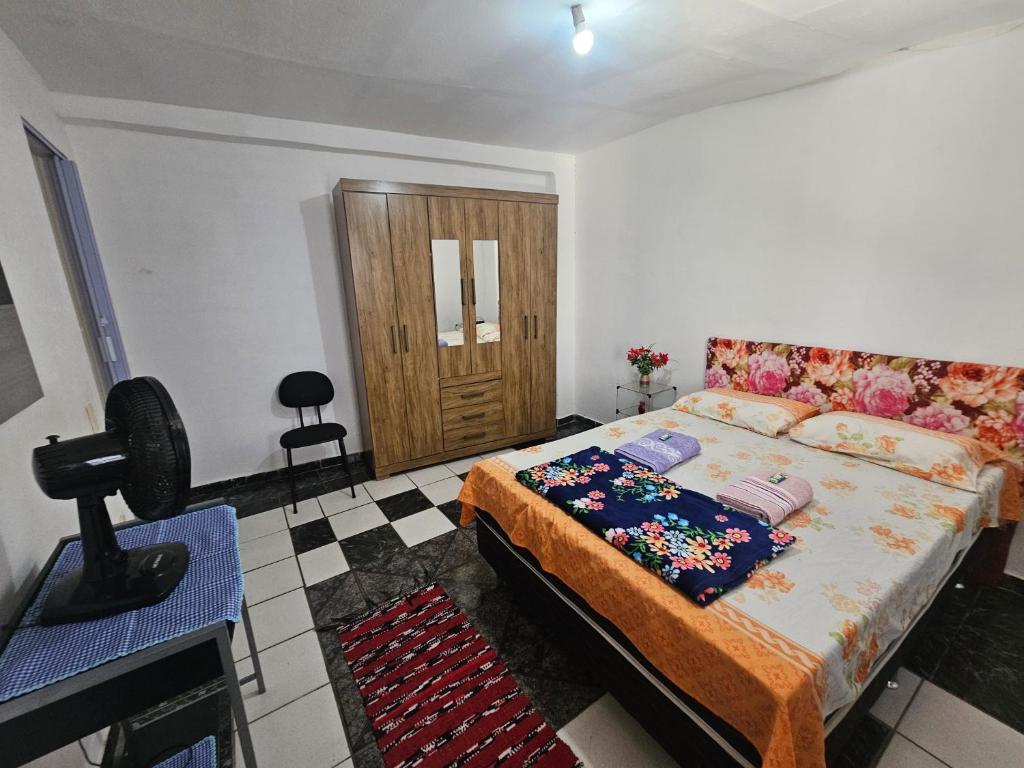 En eller flere senge i et værelse på Casa Completa com Rede próxima ao Aeroporto de Guarulhos