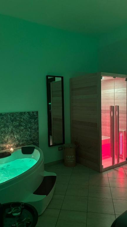 a bathroom with a tub and a toilet and a sink at Harmony Boutique inn in Bassano Romano