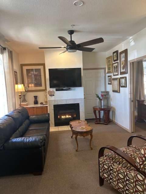 a living room with a couch and a fireplace at The Mahogany Shore in Oceano