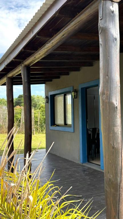 a porch of a house with a wooden roof at Casa Alfonsina in Chapadmalal