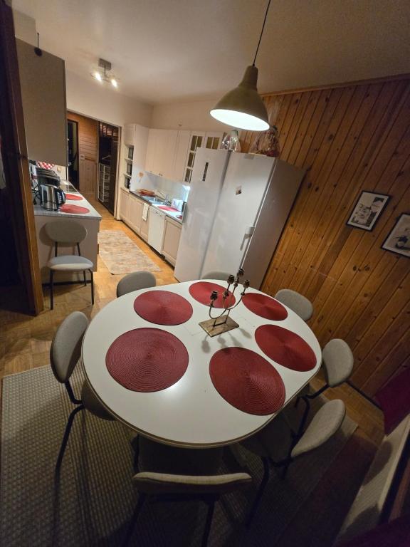 a table with red circles on it in a kitchen at Patomajat in Rovaniemi