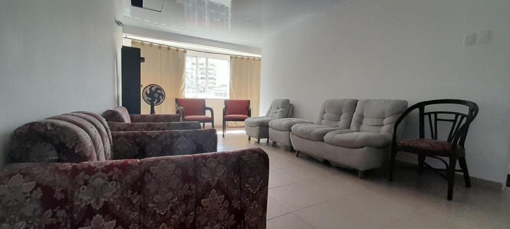 a living room with couches and a couch and chairs at Hotel Cartagena antigua in Cartagena de Indias