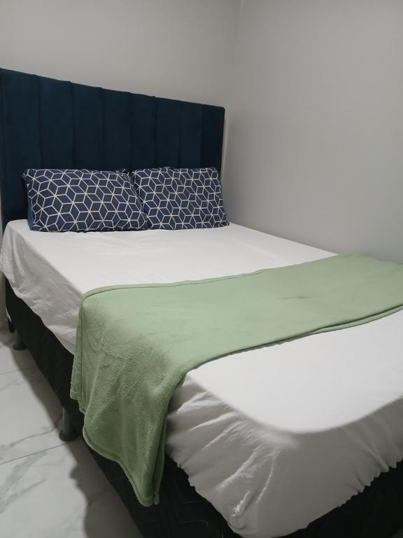 Postel nebo postele na pokoji v ubytování Mikeias sousa