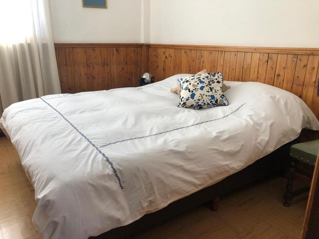 En eller flere senge i et værelse på RivadaviaApart