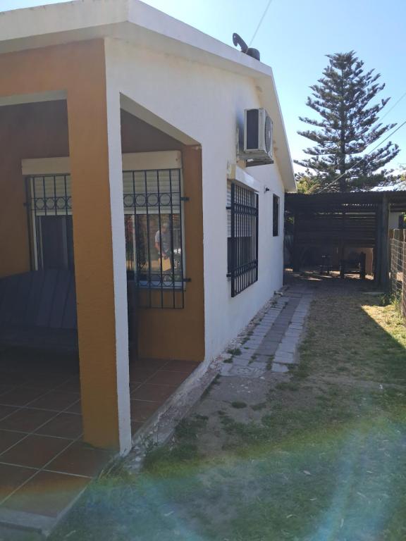 a house with a gate on the side of it at Ebenezer in Playa Hermosa