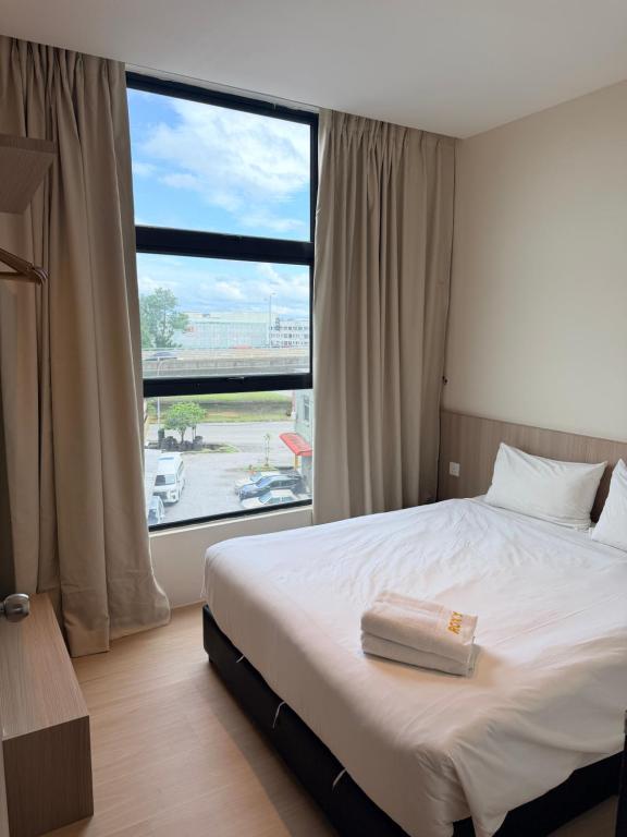 Postel nebo postele na pokoji v ubytování Roxy Hotel & Apartments