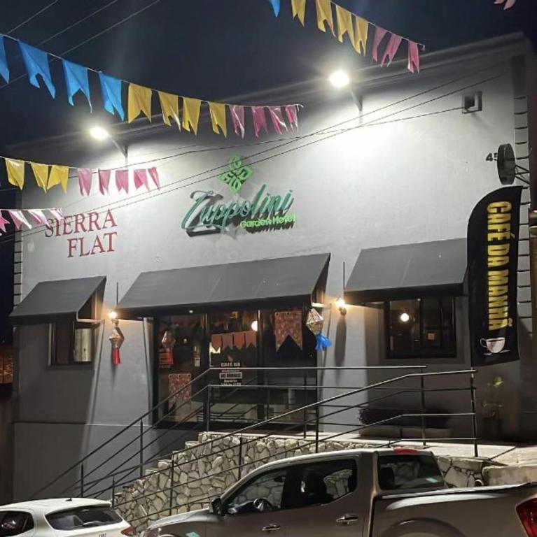 a car parked in front of a restaurant at night at Zuppolini Hotel in Bananeiras