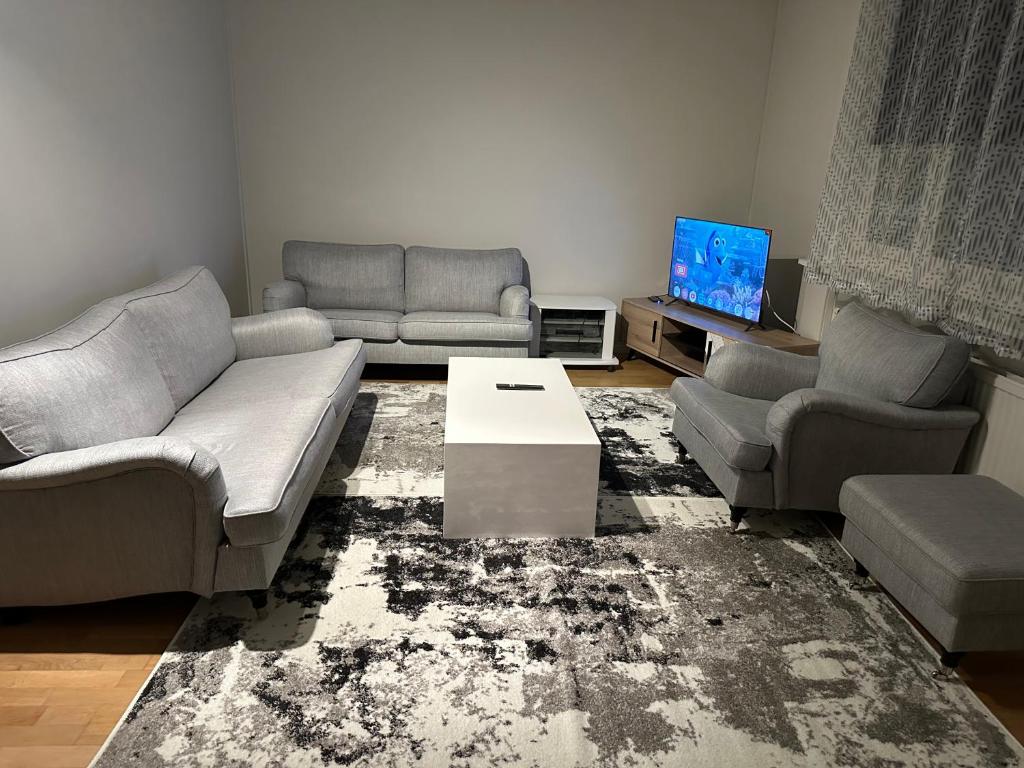 Posezení v ubytování Tapulikaupunki Apartment Helsinki