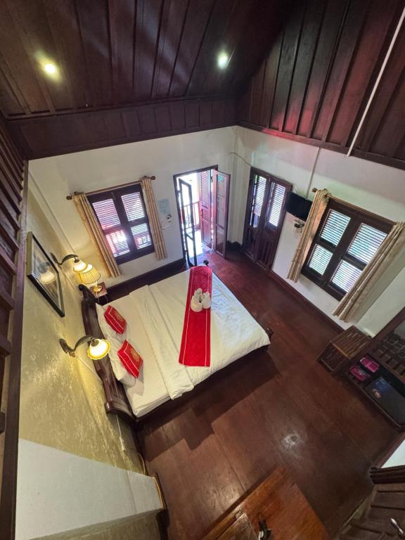 an overhead view of a living room with a red blanket at Luangprabang Villa Kee Lee in Luang Prabang