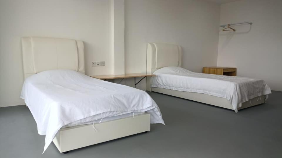 En eller flere senge i et værelse på 365 View Point Resort