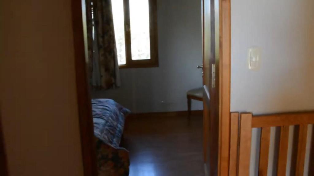 En eller flere senge i et værelse på Homero duplex