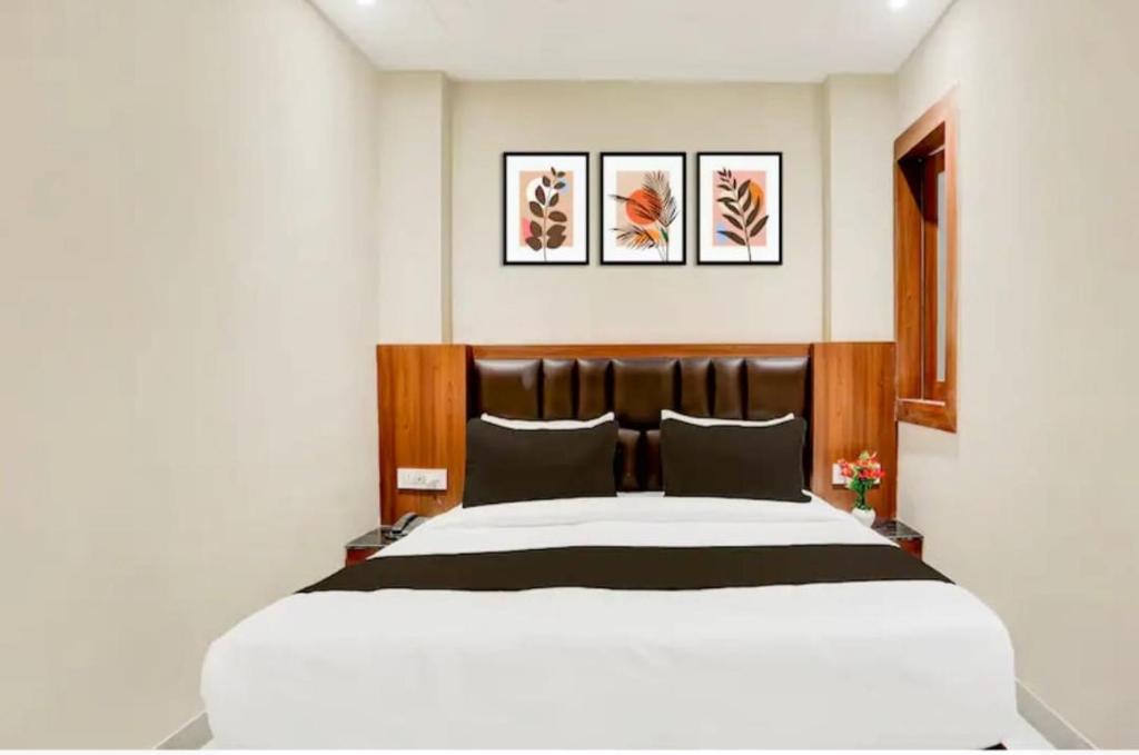 Postel nebo postele na pokoji v ubytování sunrise home stay