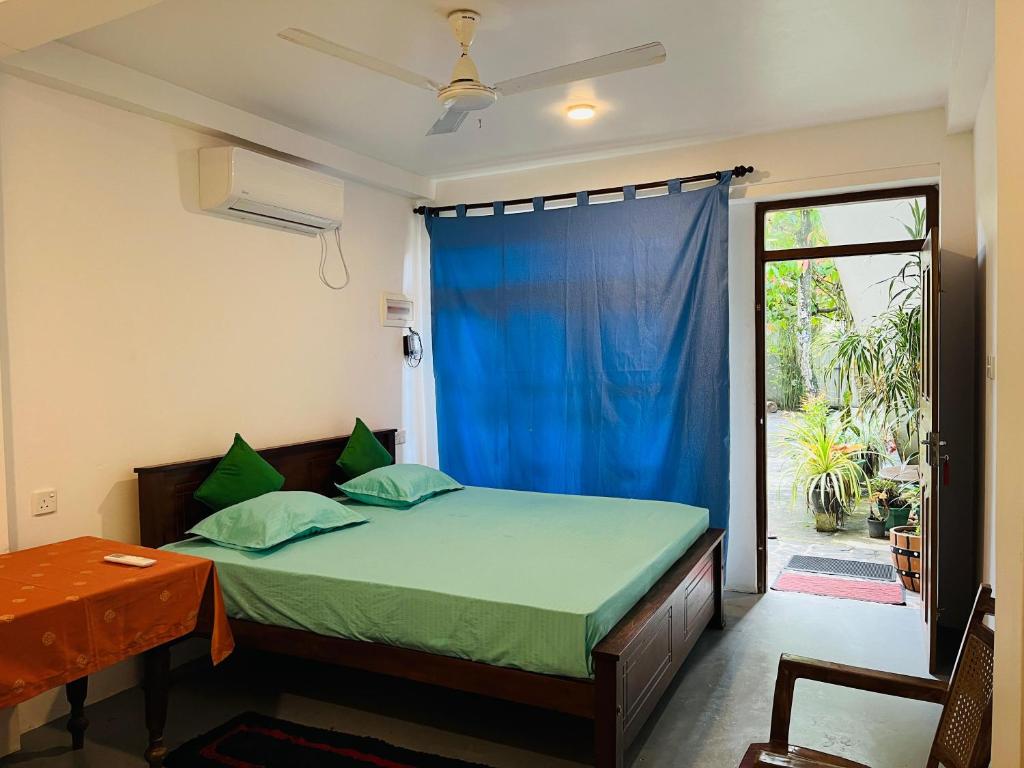 En eller flere senge i et værelse på Royal Villa