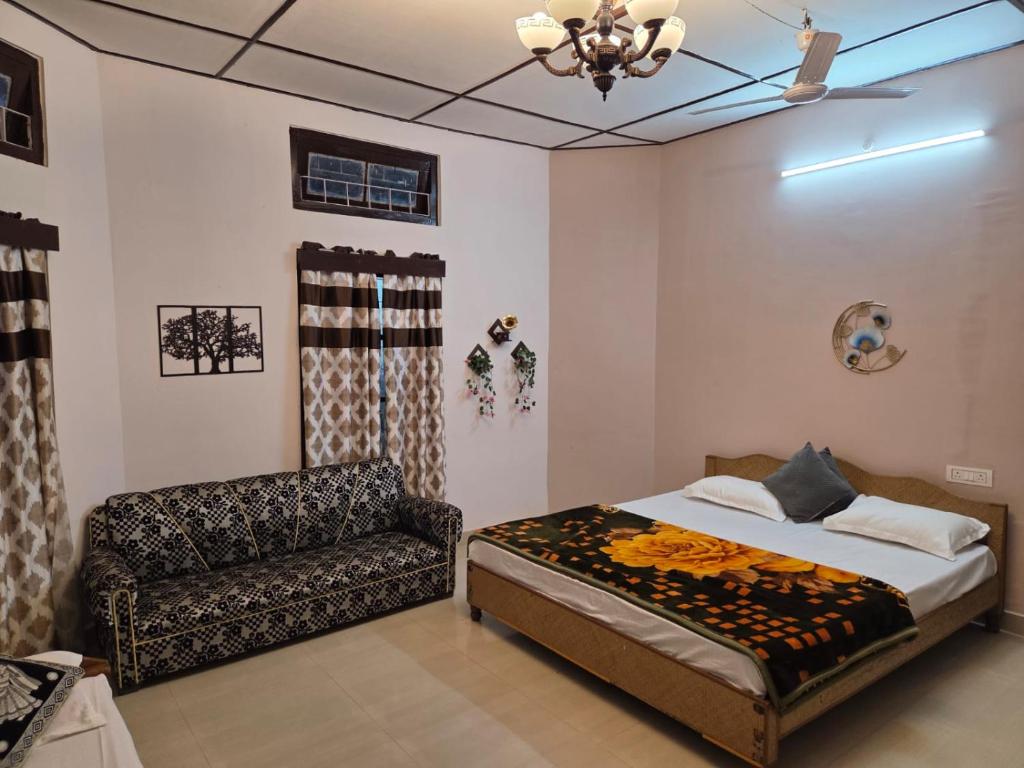 En eller flere senge i et værelse på Green Reed Resort By Meenakshi, Kaziranga