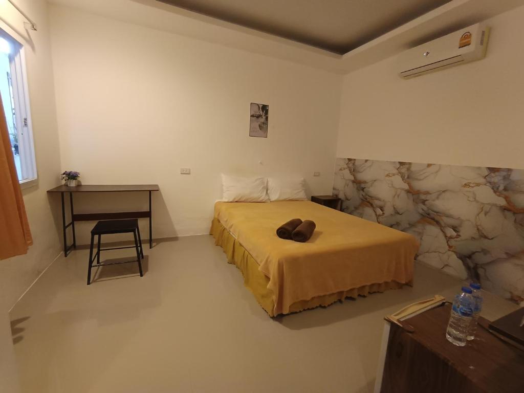 Giường trong phòng chung tại De​ Lanta place