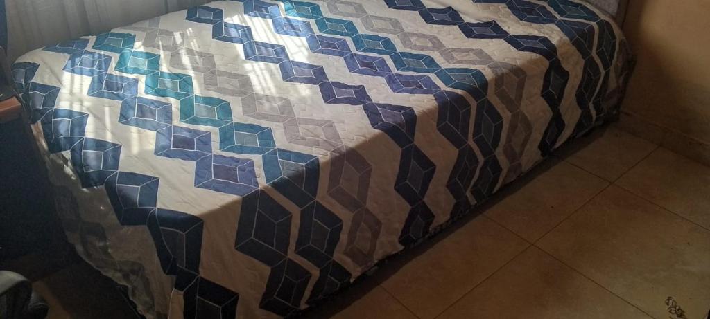 En eller flere senge i et værelse på casa de hospedaje urcunina