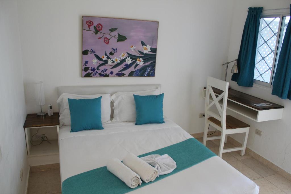 Postel nebo postele na pokoji v ubytování Bayahibe Guest House Hotel
