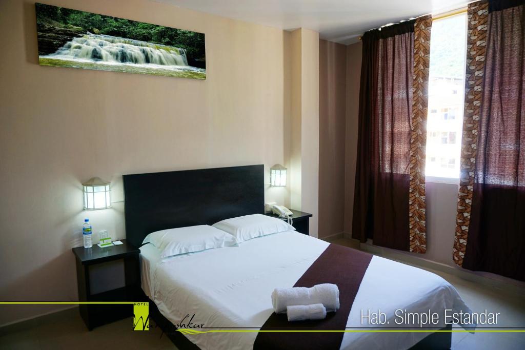 Postel nebo postele na pokoji v ubytování Hotel Wampushkar