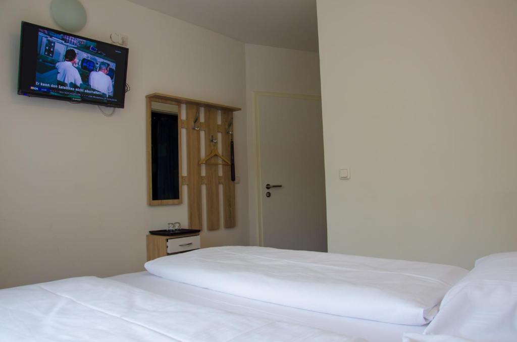 Postel nebo postele na pokoji v ubytování Panorama Hotel Frankfurt Offenbach Süd