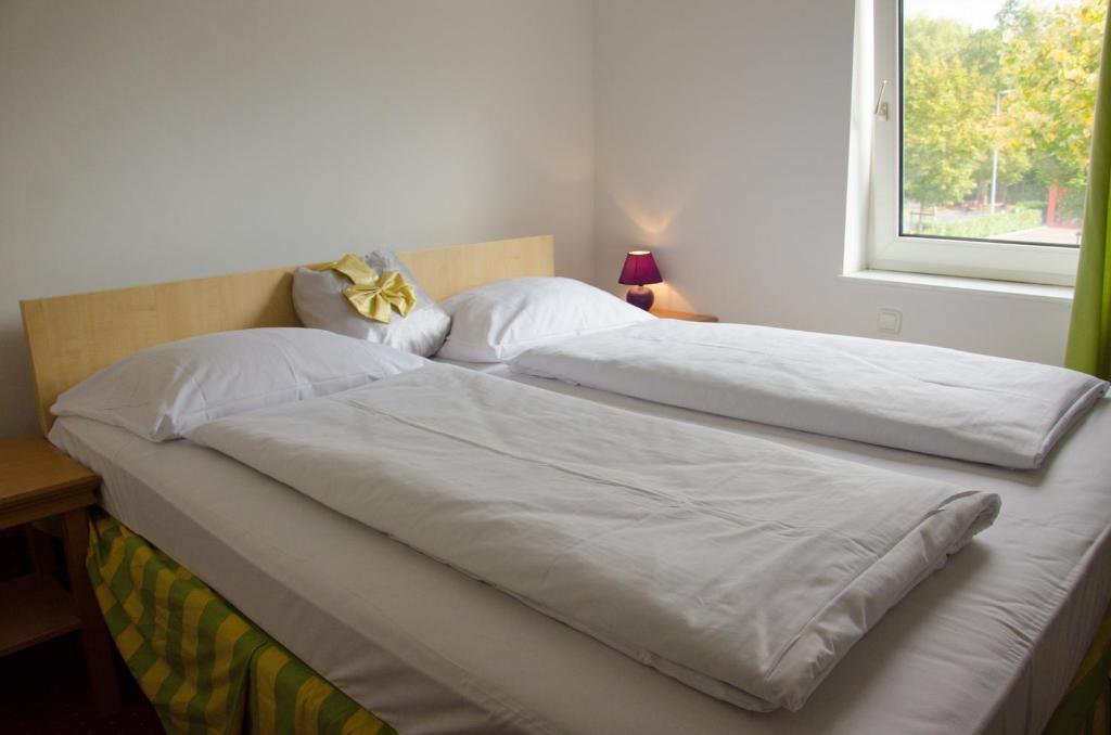 Postel nebo postele na pokoji v ubytování Panorama Hotel Frankfurt Offenbach Süd