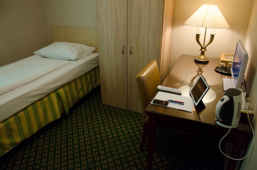 Postel nebo postele na pokoji v ubytování Panorama Hotel Frankfurt Offenbach Süd