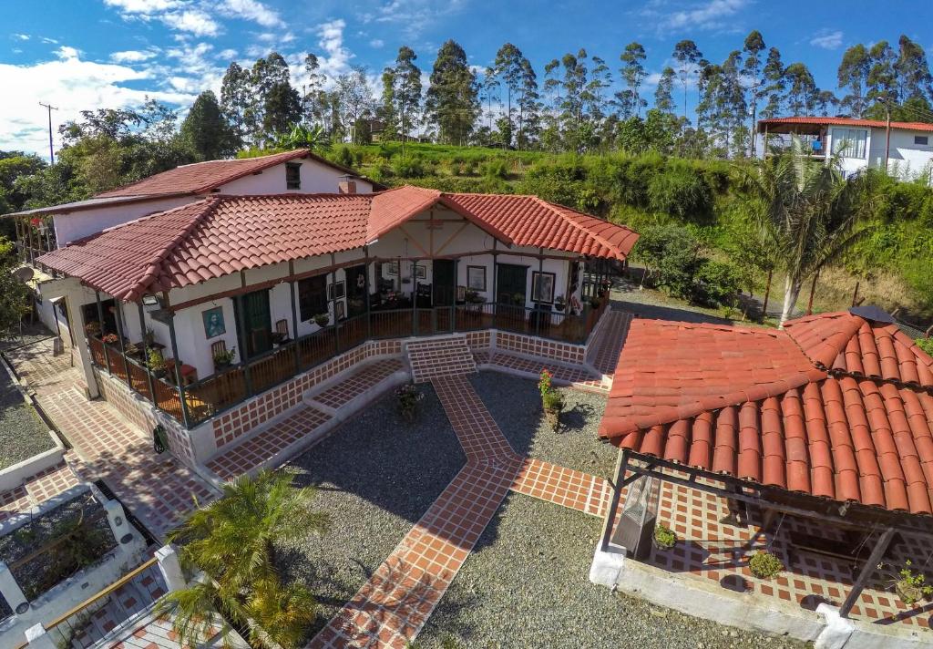 an overhead view of a house with a red roof at Finca Campestre La Adelita B&B in Salento