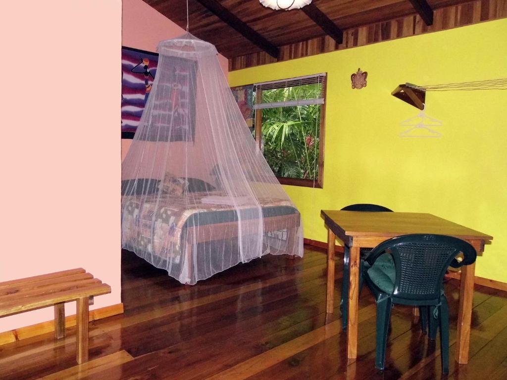 Postel nebo postele na pokoji v ubytování El Colibri Lodge