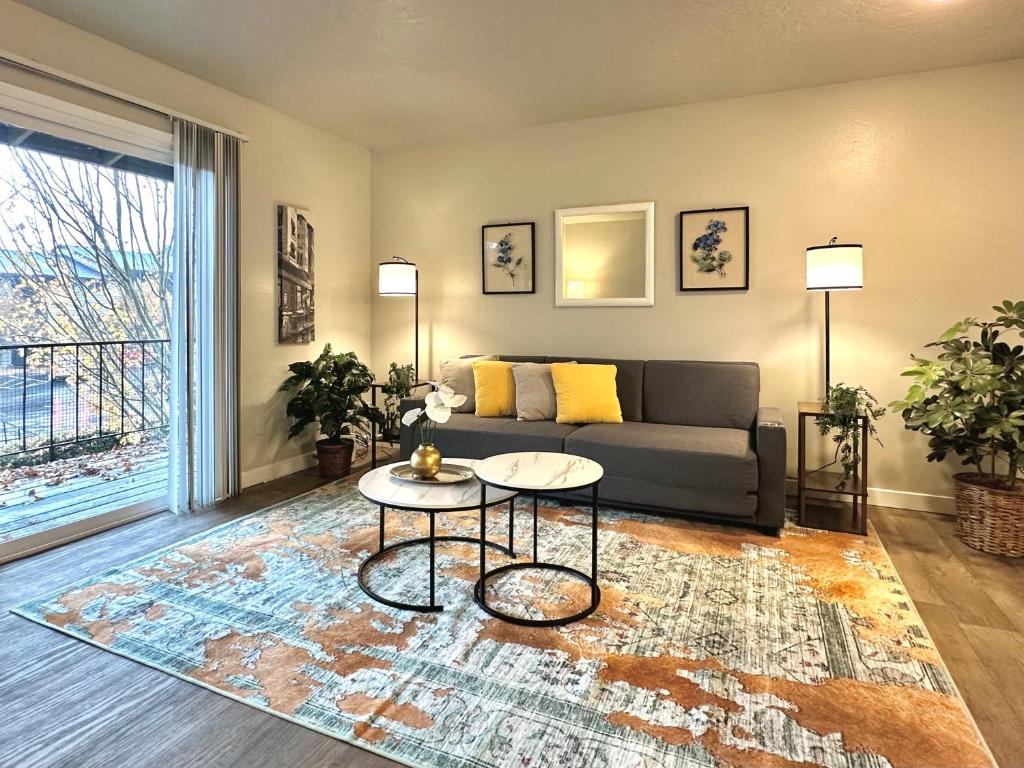 a living room with a couch and a table at Cozy One-Bedroom Haven with Big Balcony in Vancouver