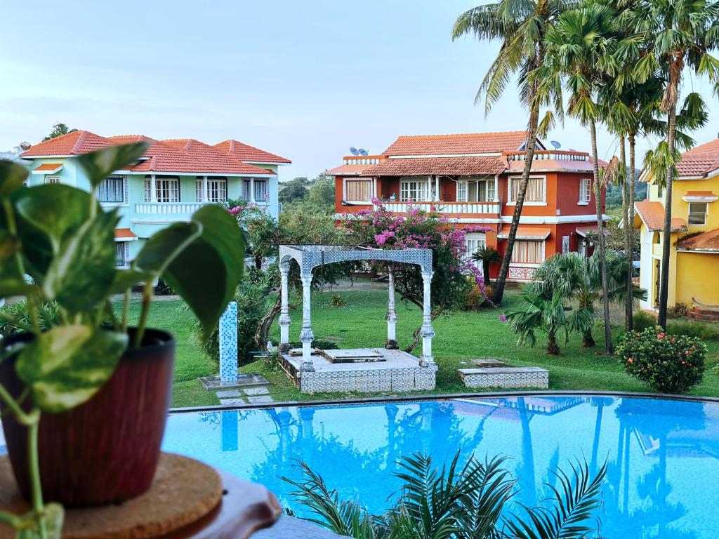 a wedding arch next to a swimming pool at Pool View Villa & Apartment By The Beach Goa in Benaulim