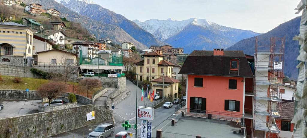 a view of a city with mountains in the background at Appartamento Edolo in Edolo