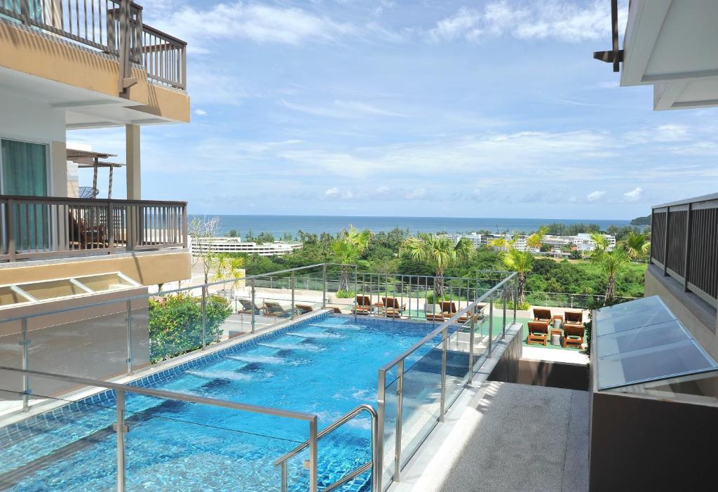 a view of a swimming pool on top of a building at Princess Seaview Resort & Spa - SHA Plus in Karon Beach
