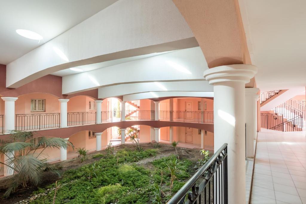 a hallway of a building with a staircase at Résidence Pierre & Vacances l'Ange Gardien in Villefranche-sur-Mer