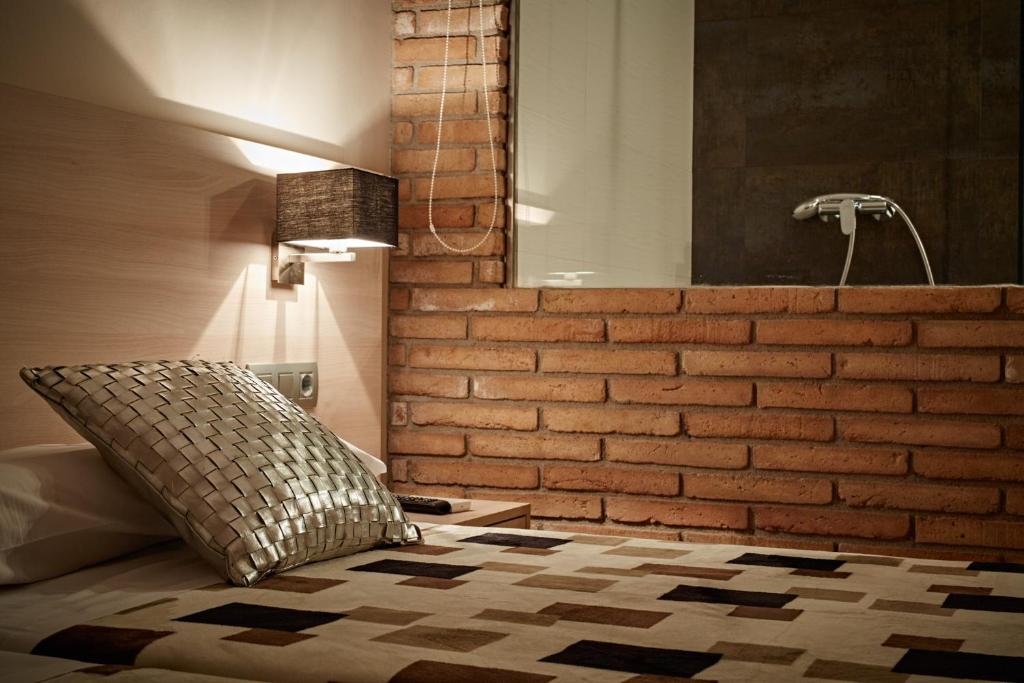 Postel nebo postele na pokoji v ubytování Hostal Crisami