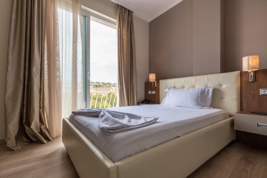 Postel nebo postele na pokoji v ubytování KEIT Hotel